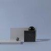 Abstract arrangement of marble surfaces with geometric shapes on a plain background.